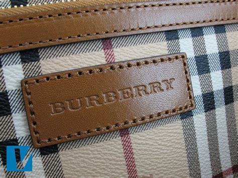 real burberry with metal emblem on purse|burberry logo handbags.